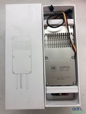 an open box with a white electronic device inside of it