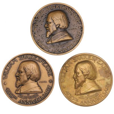 three commemorative coins with a portrait of a man and a woman on them