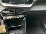 the interior of a car with a steering control and a dashboard