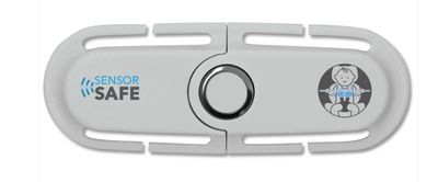 a close up of a white device with a safety button on it