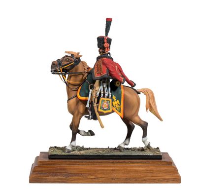 figurine of a man on a horse with a hat on