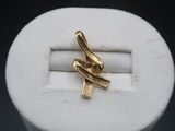 a close up of a gold ring on a white ring holder