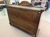 an old wooden chest sitting in the middle of a room