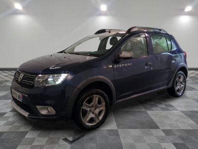 a picture of a blue car parked in a garage
