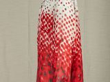 a mannequin mannequin wearing a red and white polka dot blouse