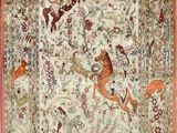 an antique persian rug with horses and birds on it