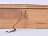 an old wooden box with a handle on it