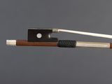 a close up of a violin bow with a string attached to it