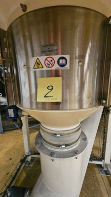an image of a stainless steel tank with a yellow sticker on it