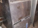 a metal dishwasher that is sitting in a room