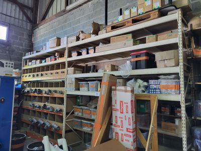 a room filled with lots of boxes and shelves