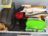 a plastic container filled with assorted items on a table