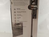 the box is open to show the contents of the new vacuum