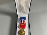 a close up of a medal in a box on a table