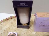 a bottle of maca on a table next to a box of mascara