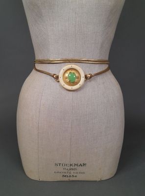 a close up of a mannequin torso with a bracelet on it