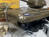 a toy tank sitting on a table next to a box