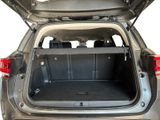the back of a car with its trunk open showing the cargo compartment