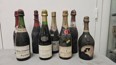 several bottles of wine are lined up on a table