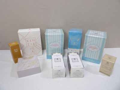 several boxes of different types of cosmetics on a white table