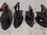 four different types of tools are lined up on a table