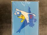 someone is holding a box with a picture of a pokemon character on it
