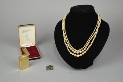 an image of a necklace and a pair of earrings on a mannequin