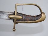 a close up view of a sword with a handle