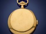 an old gold pocket watch with a chain on a blue background