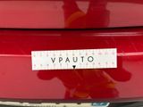 a sticker that says vauto on the back of a red car