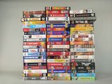 a lot of dvds stacked on top of each other