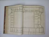 an open book with a drawing of a plan of a building