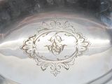 a silver plate with a picture of a man on it
