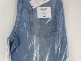 the back of a pair of blue jeans wrapped in plastic