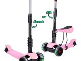 une paire de trottinettes roses avec des roues noires et des roues roses