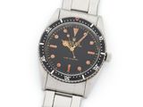 an image of a close up of a wrist watch on a white surface
