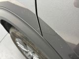 a close up of a car ' s door handle with a sticker on it