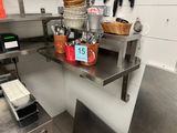 a small kitchen with a lot of utensils on the counter