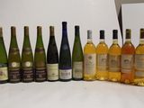 a lot of bottles of wine on the table