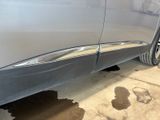 a close up of a car ' s door handle on the side of the car