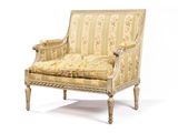 une image d'une chaise avec un dossier rembourré à motifs floraux