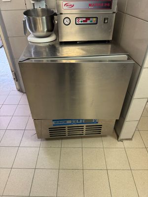 a machine that is sitting in the corner of a kitchen