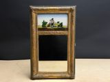un vieux cadre contenant un tableau représentant un homme et une femme