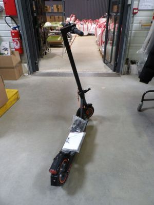 a scooter that is sitting in the middle of a room