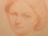 an old drawing of a woman with red hair and a hat