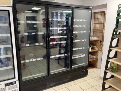 a refrigerator that is sitting in the middle of a store
