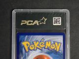a close up of a pokemon card on a black surface