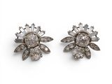 an image of a pair of diamond earrings on a white background