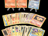a lot of pokemon cards that are on the table