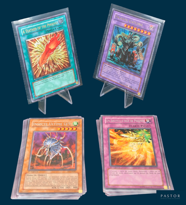 four different types of pokemon cards are displayed on a stand